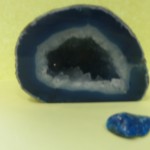 Image of a blue geode with a small, smooth blue gem.