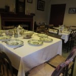 Typical boarding house dining room setup for supper with china and silverware for the Yankee Mill Girls.