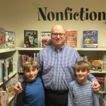 Mr. Keohane and the Chickering Reporters in the school library.