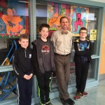 Mr Harte with 3 Chickering reporters outside the computer lab.