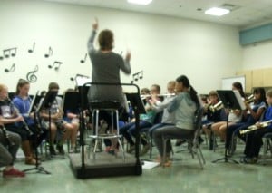 Mrs. Barry Conducting Chanton Canon, a song 4th grade band plays.