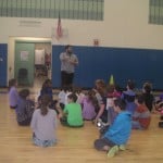 Image of Mr. Fraser instructing his students in the gym.